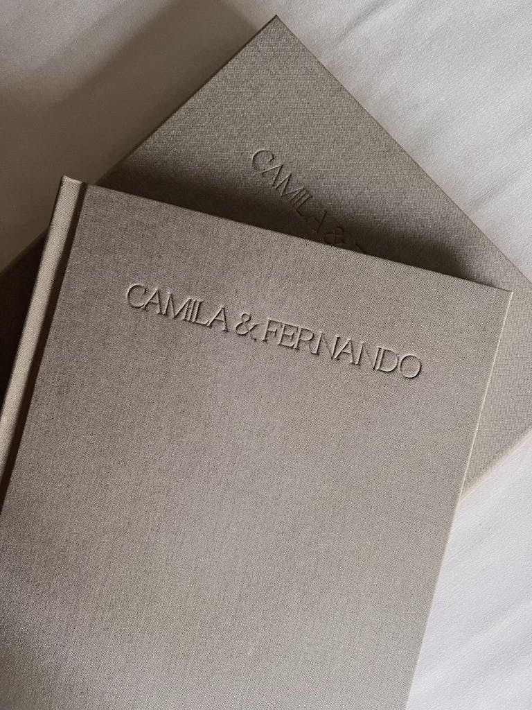 Elegant linen-bound photo albums with personalized embossed names.